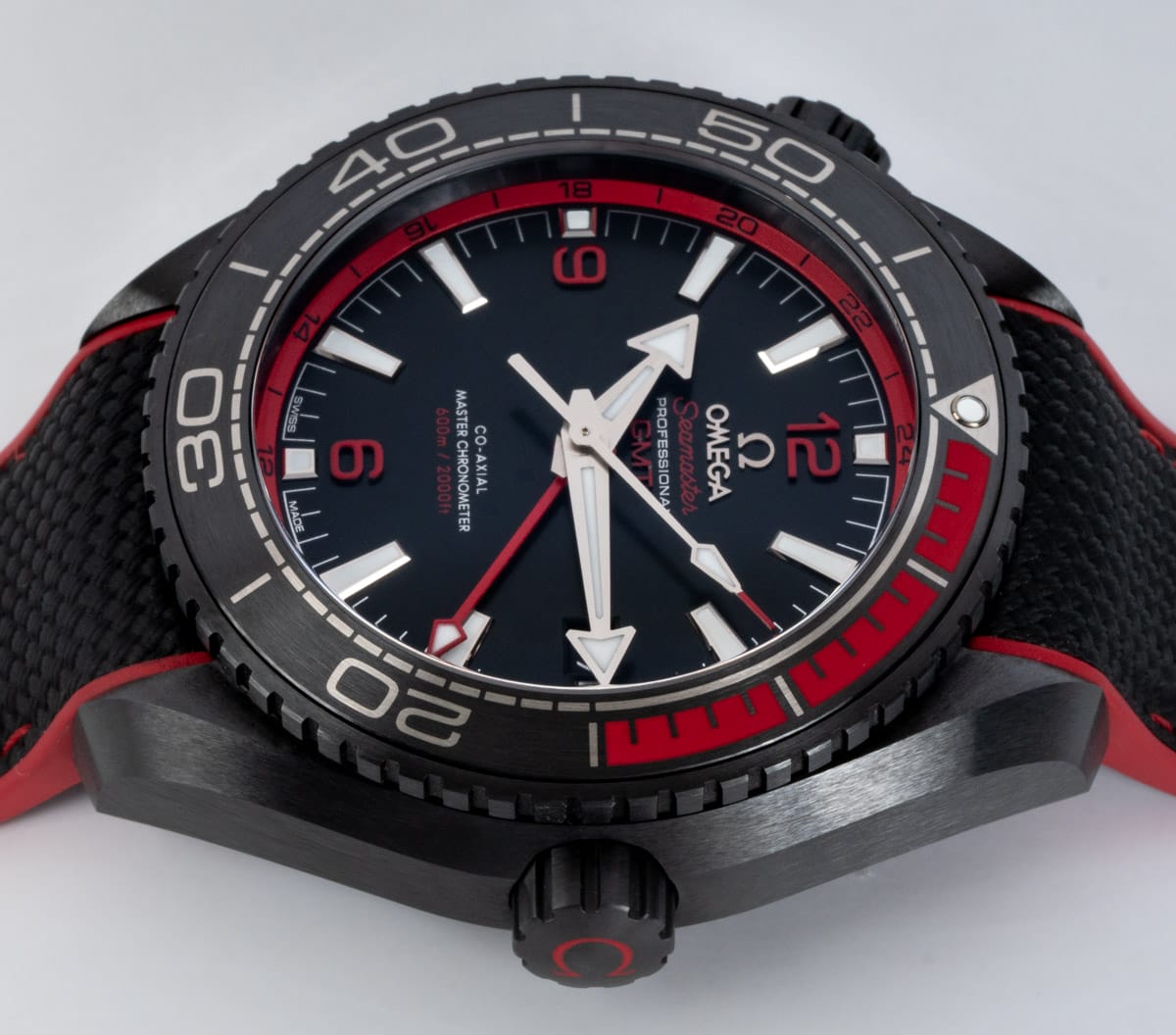 Crown Side Shot of Seamaster Planet Ocean GMT 'Deep Black' Red